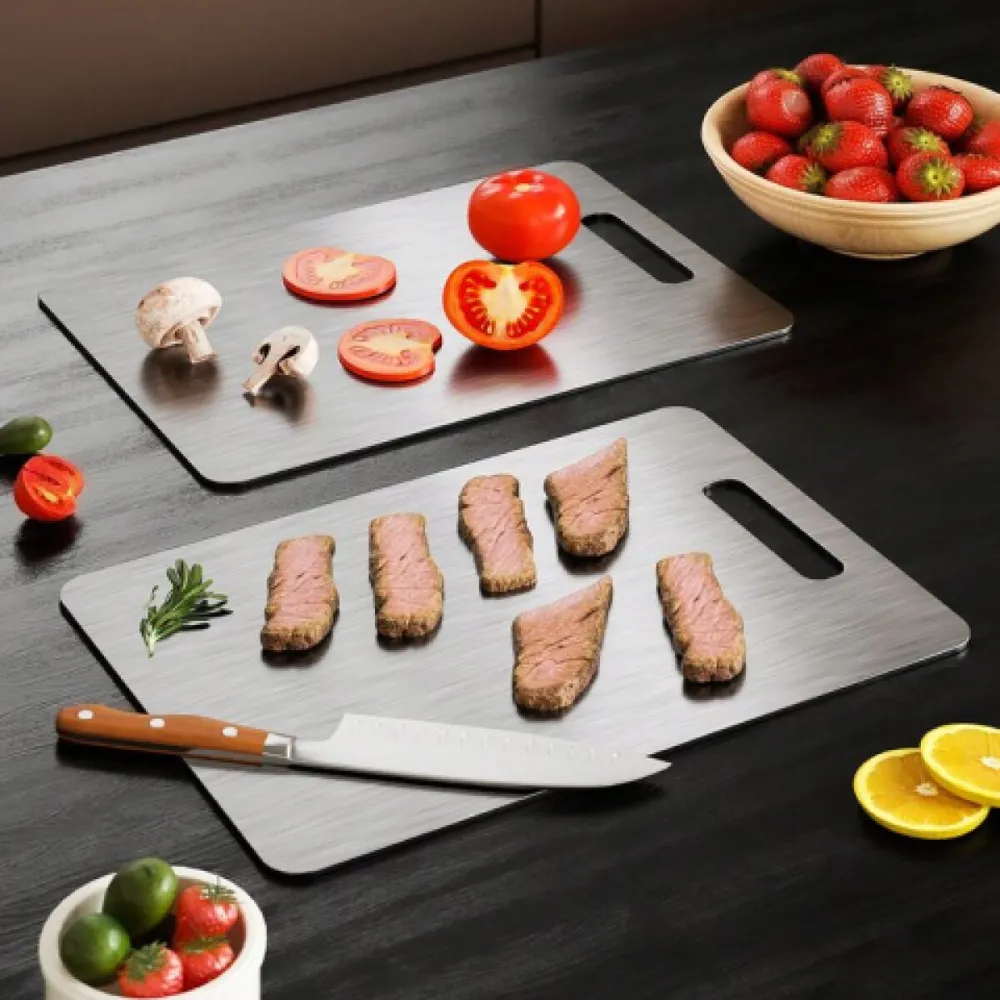 Two Katori titanium boards with raw meat and tomatoes