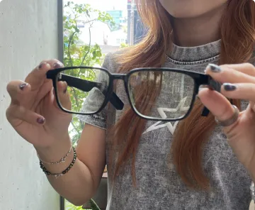 Customer holding NeuroView glasses