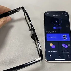 NeuroView glasses pairing with the free app on a smartphone
