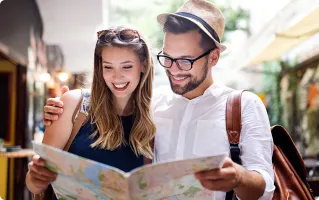 Couple of travelers reading a map while wearing smart glasses